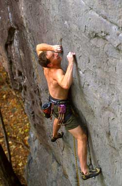mountain climber gripping rocks