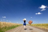 lonely-girl-with-suitcase-at-country-road
