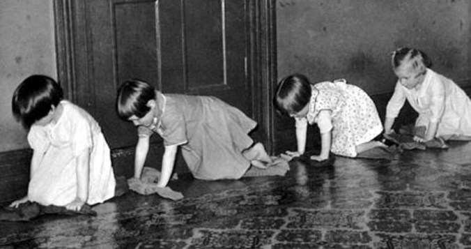 Girls in an orphanage scrubbing floors