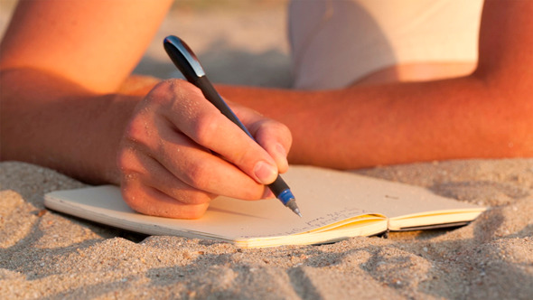 writing at beach