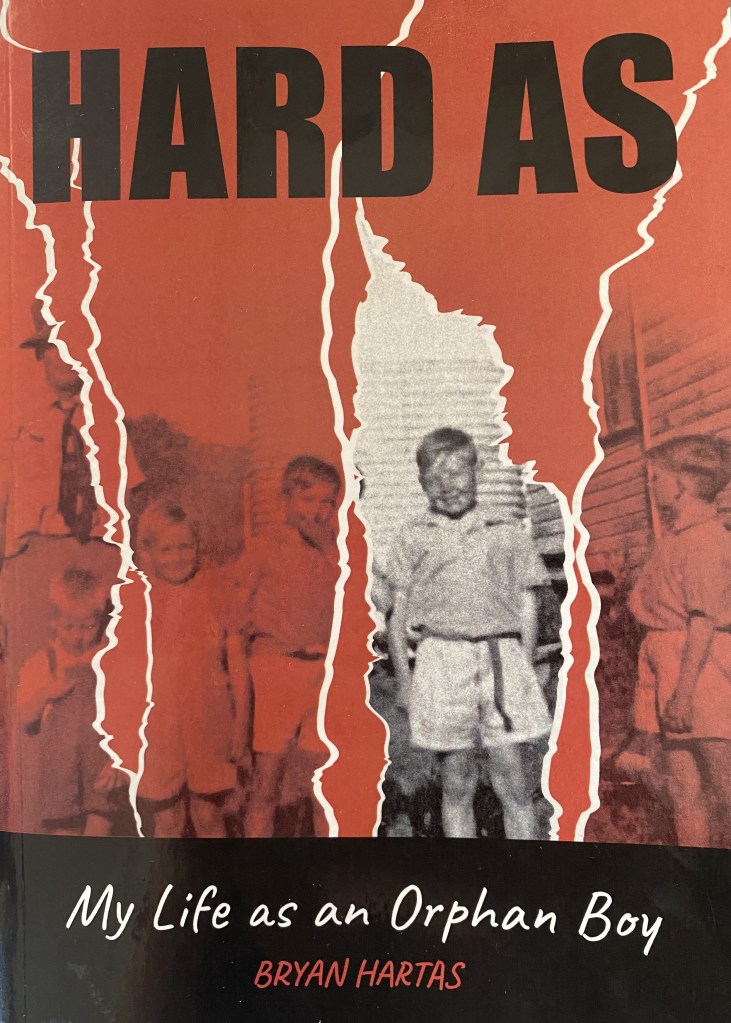 A photo of the cover of Edwina's book "hard as my life as an orphan boy"