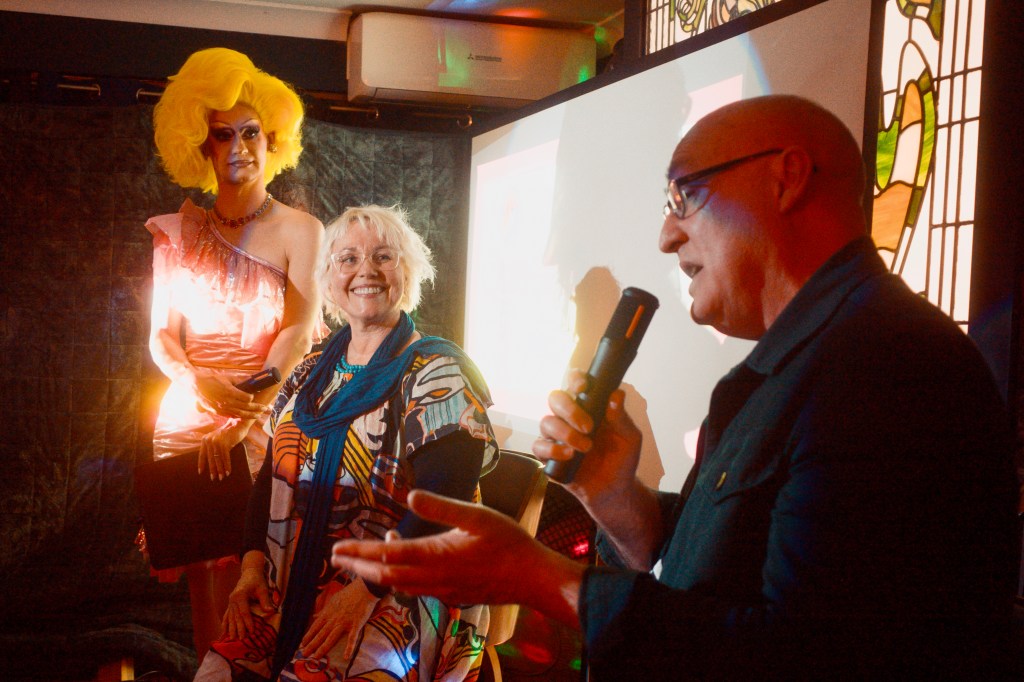 Editors, Edwina Shaw and Rod Goodbun discuss the creation of Queersland at the book launch, with drag queen hostess Evalyn Eatdith looking on.